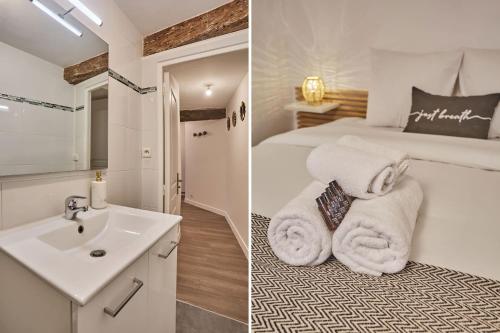 La salle de bains est pourvue d'un lavabo et d'un lit avec des serviettes. dans l'établissement Superb apartment in the center of Paris by Stusioprestige, à Paris