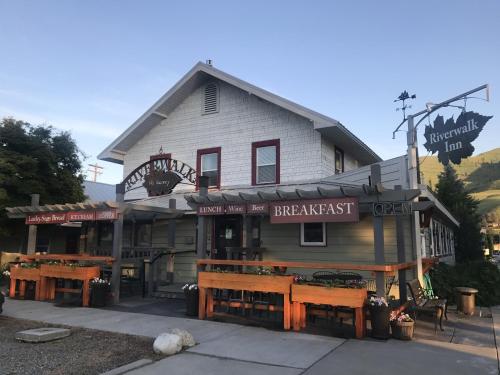 a large building with a restaurant in front of it at Riverwalk Inn in Chelan