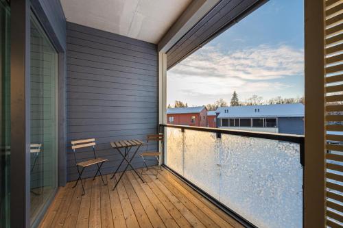 a balcony with a view of a building at Vesirattaantie Apartment in Espoo