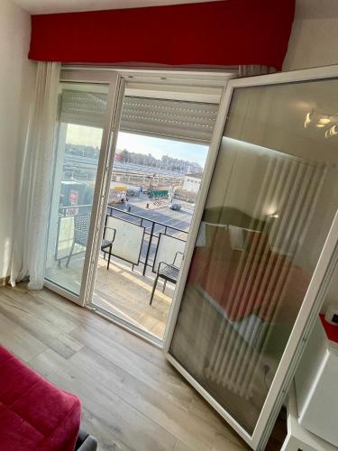 a living room with a large glass window with a view at ARBI VENICE STATiON in Mestre