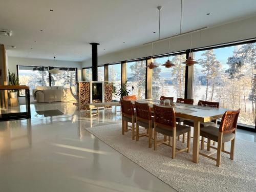 a dining room with a table and chairs at Unique lakehouse Villa Valo in Hollola