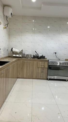 a kitchen with a sink and a stove at The Canopy Haven in Sagwari