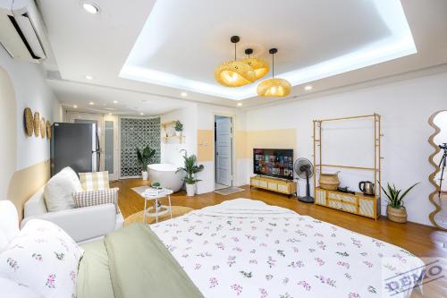 a living room with a couch and a table at Luxe Paradise Residence 273 Ton Duc Thang in Hanoi