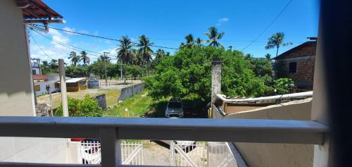 a view of a street from a balcony at Casa de Praia - temporada in Valença