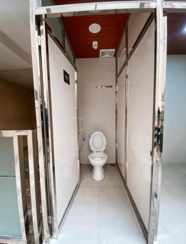 a bathroom with a toilet in a room at 2BR Apartement Sudirman Bandung in Bandung