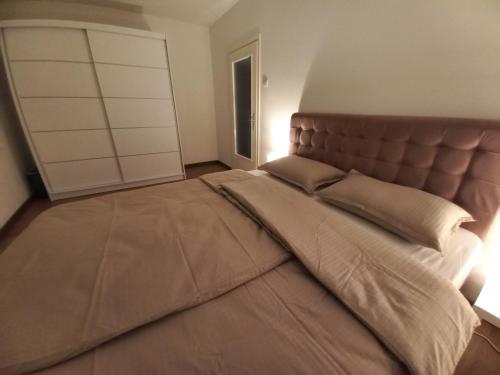 Postel nebo postele na pokoji v ubytování Apartman Mina