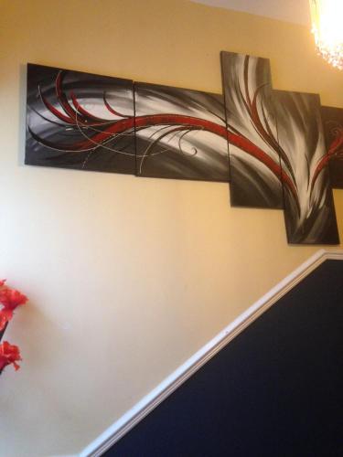 a painting is hanging on a wall at Lynebank House Hotel, Bed & Breakfast in Carlisle