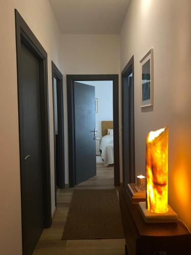 a hallway of a hotel room with a bedroom at Villa Perla del Sole in Baiardo
