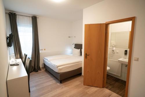 Ein Bett oder Betten in einem Zimmer der Unterkunft Gutshof Havelland
