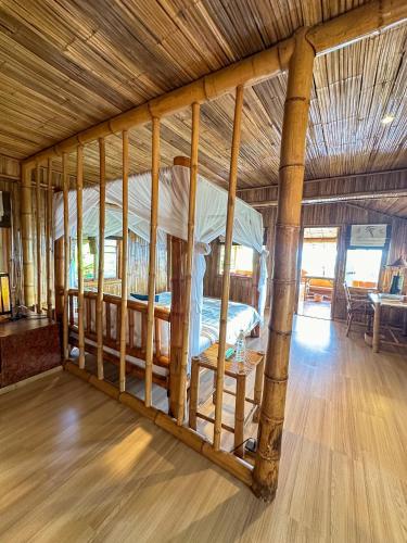 a bedroom with a bunk bed in a room at Phu Chaisai Chiang Rai Mountain Resort in Mae Salong Nai