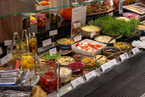 a buffet with many different types of food on display at Wyndham Wroclaw Old Town in Wrocław
