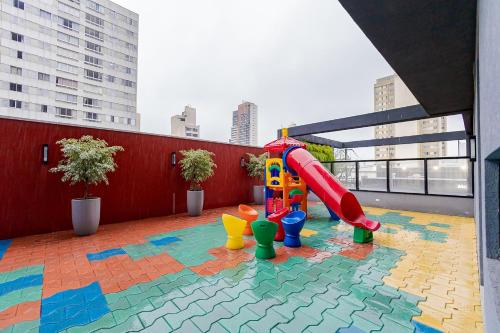 a playground with a slide on a rooftop at Elysia in Curitiba