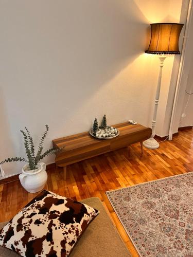 a living room with a couch and a table at Mylos House in Tríkala