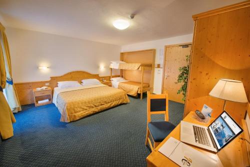 Ένα ή περισσότερα κρεβάτια σε δωμάτιο στο Hotel Cristallo