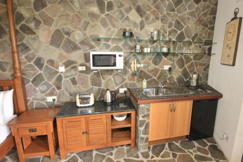 Kuchyň nebo kuchyňský kout v ubytování Tropical Hideaway