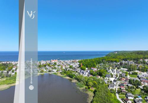 an aerial view of a city and a lake at Schlösschen am Meer in Binz