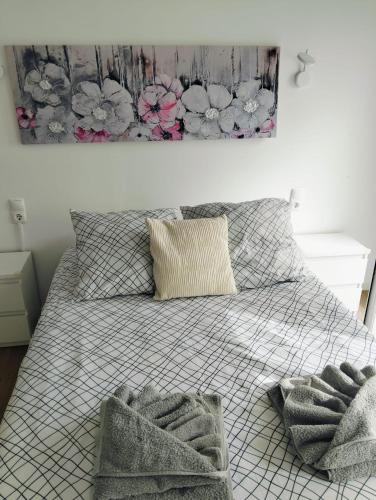 a bedroom with a bed with two towels on it at Casa do Mar in Funchal