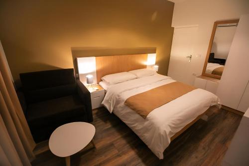 Postel nebo postele na pokoji v ubytování Hotel Sidi