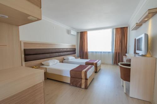 Cama o camas de una habitación en Hotel Caprea