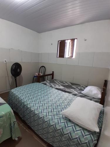 Postel nebo postele na pokoji v ubytování casa de dois quartos com cozinha perto do aeroporto Aluízio Alves