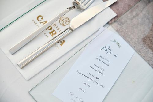 Certificado, premio, señal o documento que está expuesto en Hotel Caprea