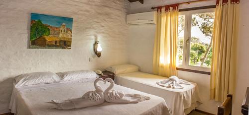 Ein Bett oder Betten in einem Zimmer der Unterkunft Posada Pecos