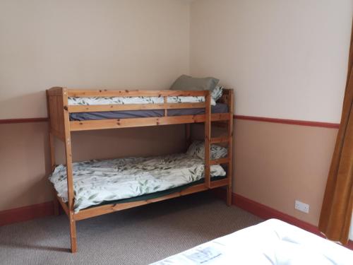 a bunk bed room with two bunk beds at Carlisle Homestay - Family Room in Carlisle