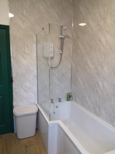 a bathroom with a shower and a bath tub at Carlisle Homestay - Family Room in Carlisle