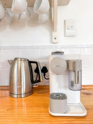a coffee maker on a counter in a kitchen at Family Home in Napier in Napier