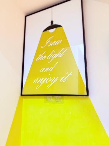 a picture of a sign on top of a yellow table at Dandelion's Travel Homestay in Jian