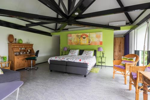 Postel nebo postele na pokoji v ubytování B&B van Dinter