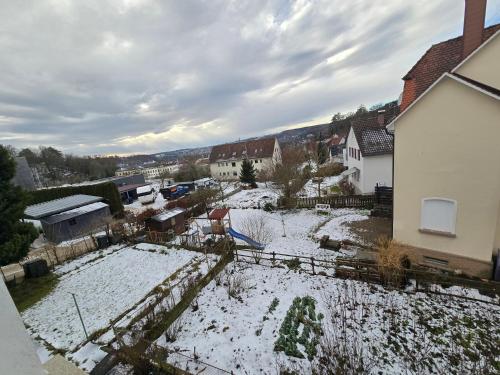 an aerial view of a snow covered yard with houses at Ferienwohnung Sigmaringen in Sigmaringen