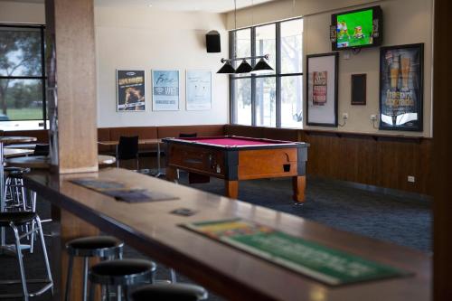 a ping pong table in a room with a pool table at Nightcap at Playford Tavern in Elizabeth