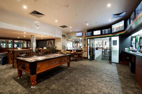 a room with a pool table in a restaurant at Nightcap at Playford Tavern in Elizabeth