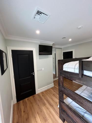 a bedroom with a bed and a black door at Drumconnick House in Cavan