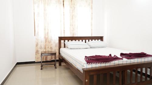 Ένα ή περισσότερα κρεβάτια σε δωμάτιο στο Araliya Golden Hotel