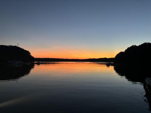 a view of a river at sunset at 船で行く 1日1組限定の絶景宿 うみらぼ in Shima