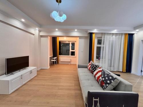 Televisyen dan/atau pusat hiburan di A cosy apartment city palace