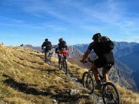 a group of people riding bikes on a mountain at Ambienthotel Spiaggia in Malcesine