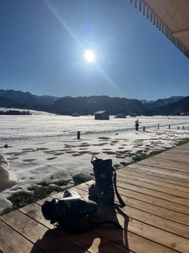 a backpack sitting on top of a wooden boardwalk at Haus 7&50 in Bolsterlang