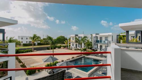 a view of the pool from the balcony of a building at Genesis Residences in Meads Bay