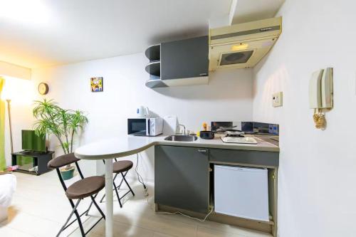 Η κουζίνα ή μικρή κουζίνα στο Apartment Yunagi