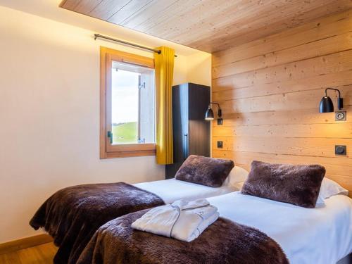 Postel nebo postele na pokoji v ubytování Appartement 4 pièces avec spa et parking – Les Saisies - FR-1-810-27