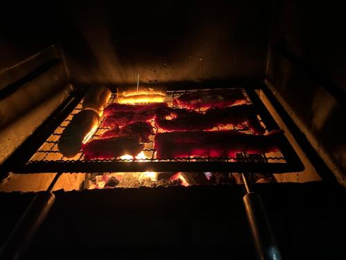 an open oven with food cooking in it at Casa Riqueza da terra in Lucas do Rio Verde