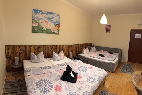 Postel nebo postele na pokoji v ubytování Penzión Astoria