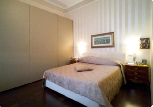 Posteľ alebo postele v izbe v ubytovaní Belledonne apartments