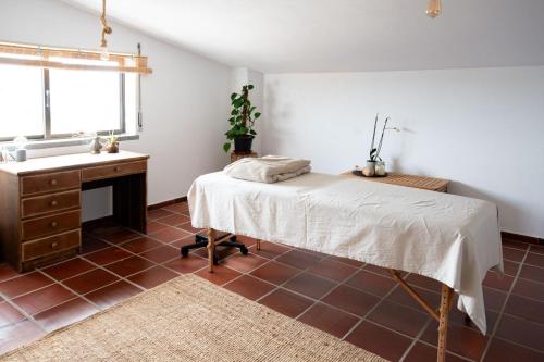 a bedroom with a bed and a sink at Villa Intuitiva - Relaxation and Mindful Stay in Lourinhã