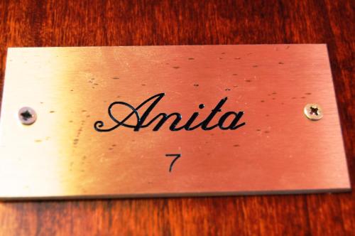 a sign that says antica on a wooden table at Borgo Nuovo San Martino in Ambra