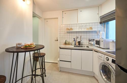 Kuchyň nebo kuchyňský kout v ubytování Jongnorang