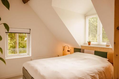 Ένα ή περισσότερα κρεβάτια σε δωμάτιο στο Boutiquehotel & Tiny houses PLEK17